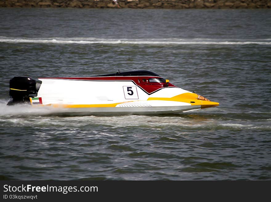 View of a powerboat race on a lake in Portugal. View of a powerboat race on a lake in Portugal.