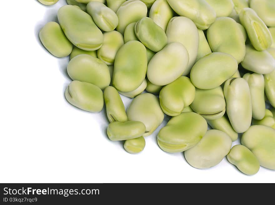 Close up view of some broad beans isolated on a white background.