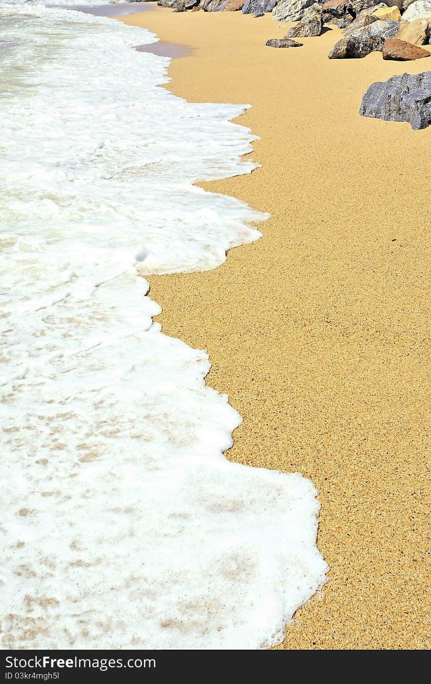 The wave on a seashore and stones