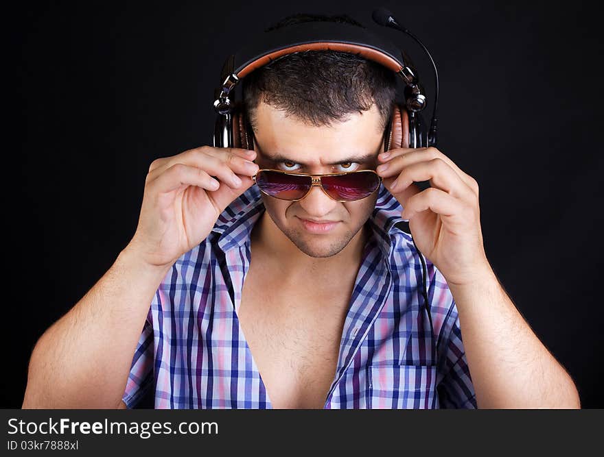 Man is listening music and staring. Man is listening music and staring