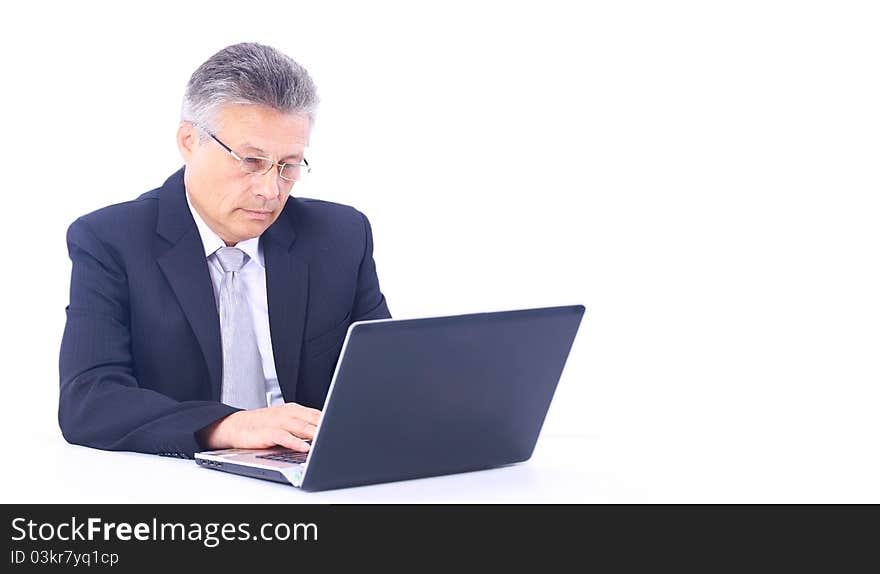 Senior business man working on laptop