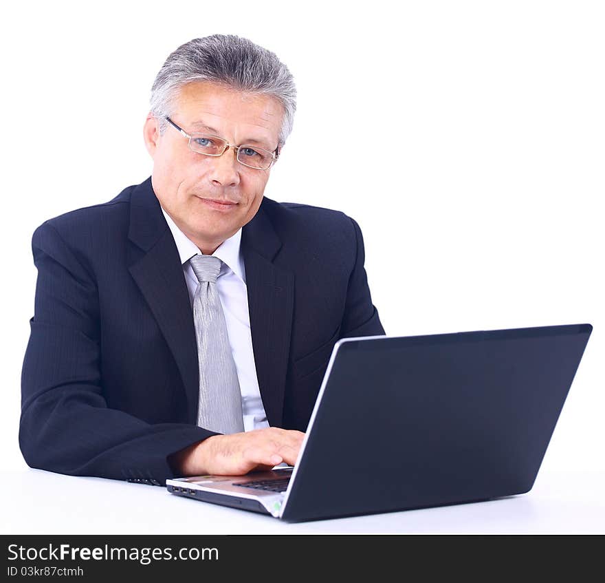 Senior business man working on laptop