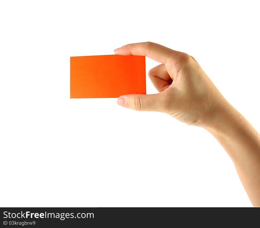 Woman's hand and orange card isolated on white