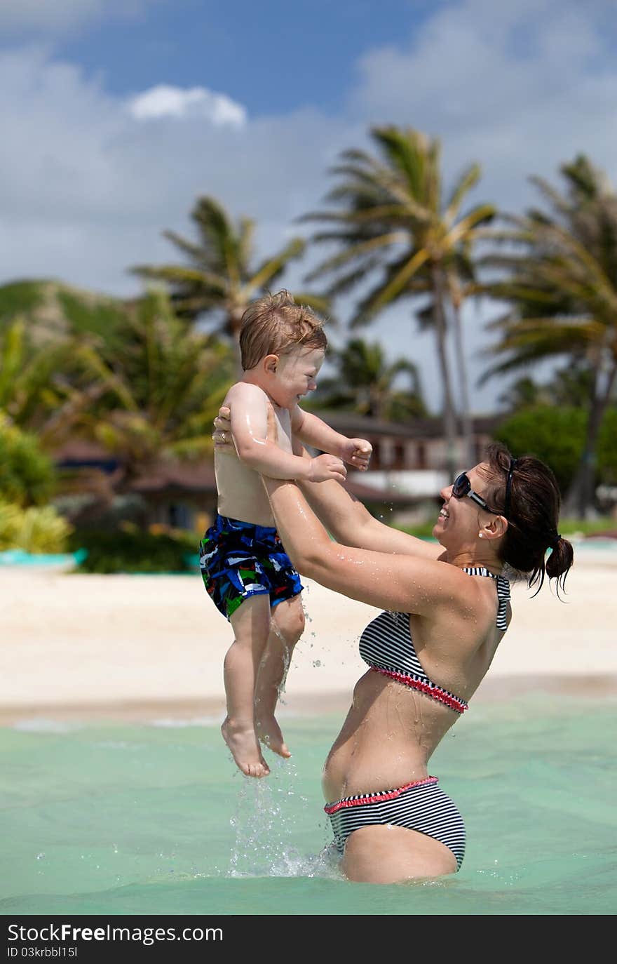 Mother and son having fun in the water