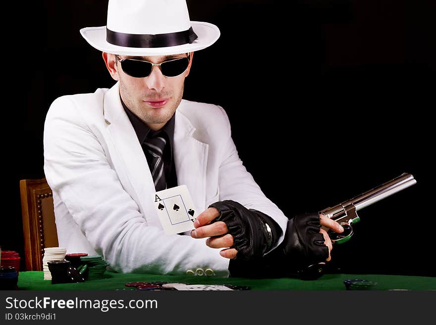 View of a white suit gangster man holding a gun.