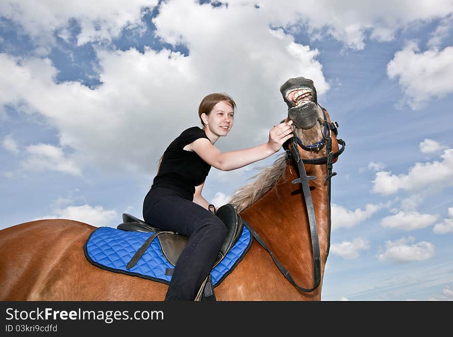 Nice Girl riding and feeding a Horse. Nice Girl riding and feeding a Horse