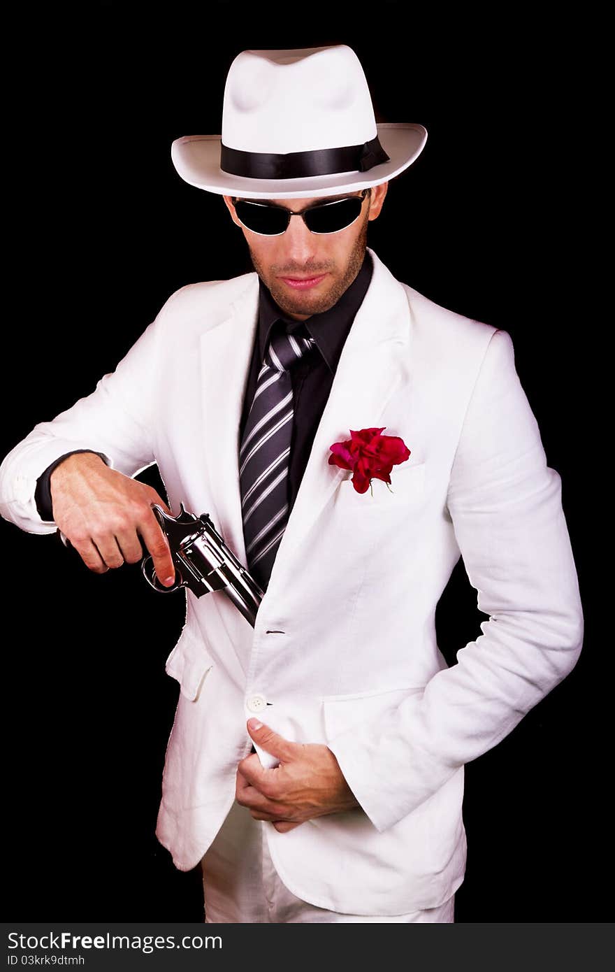 View of a white suit gangster man holding a gun.