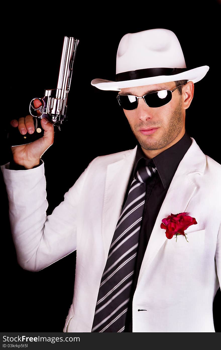 View of a white suit gangster man holding a gun.