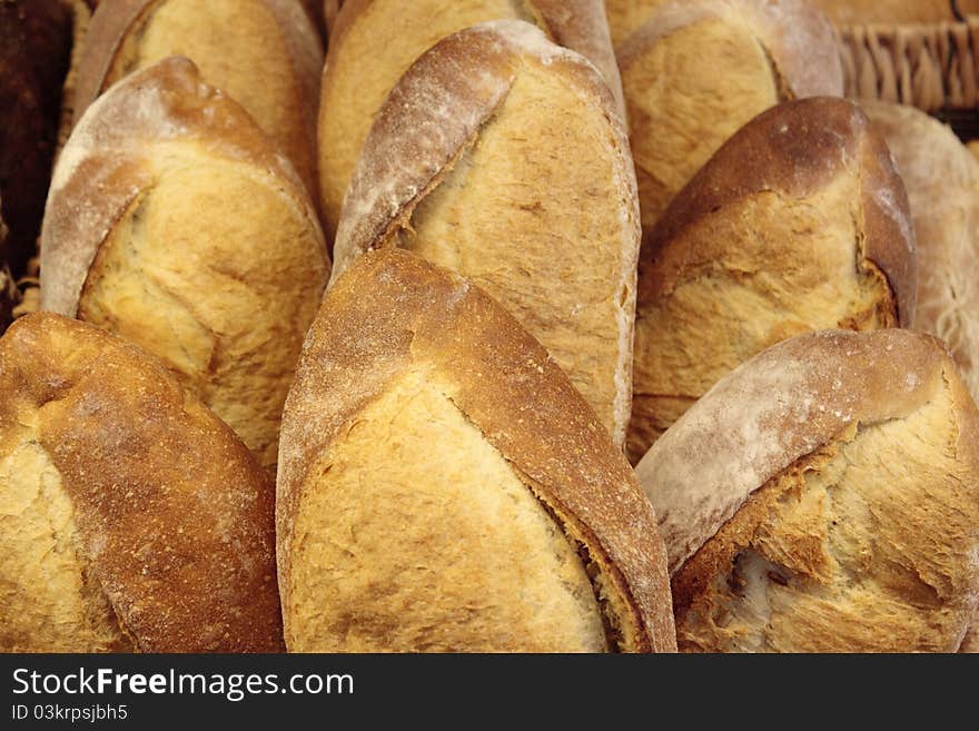 Image of loaves of bread for sale at a market.