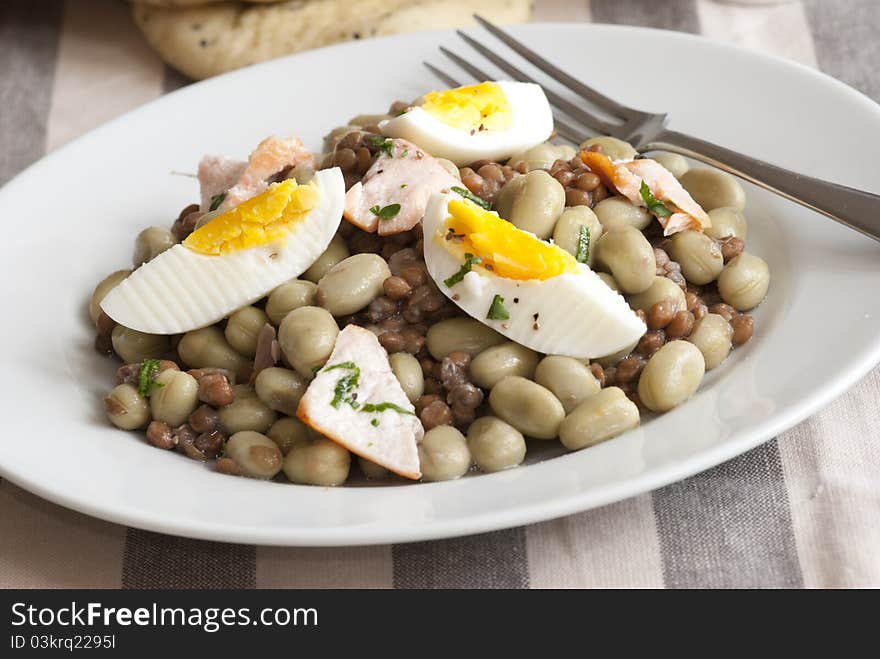 Grilled salmon, soya bean and boiled egg salad on a plate. Grilled salmon, soya bean and boiled egg salad on a plate