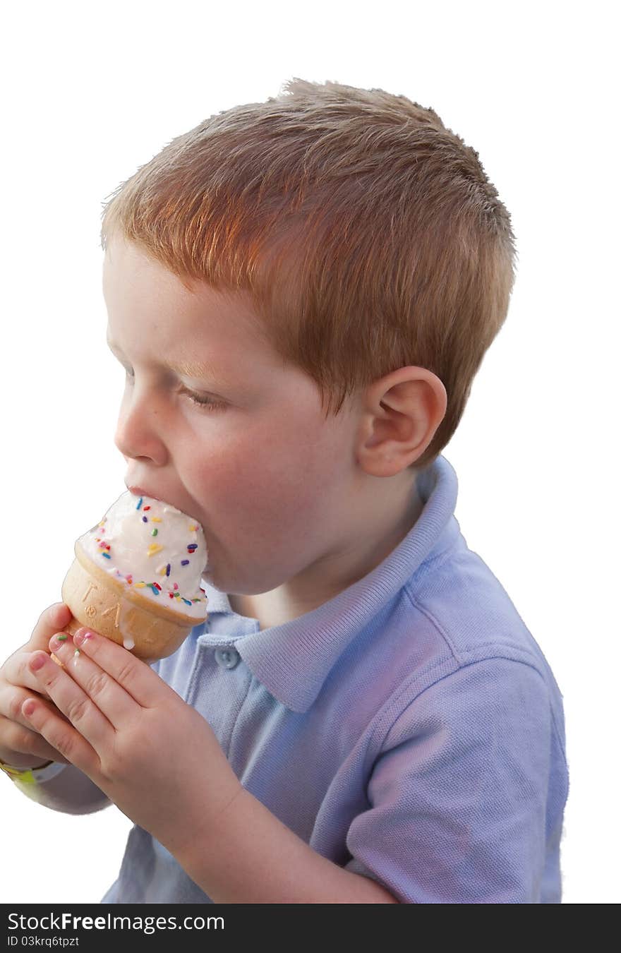 A young boy eating an ice cream cone.