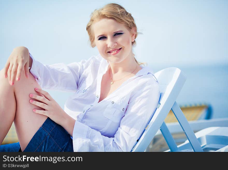 Beautiful Woman Sitting In Chaise