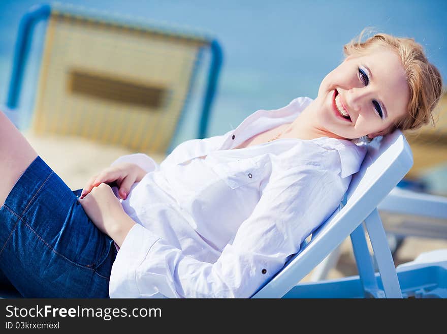 Beautiful Woman Sitting In Chaise