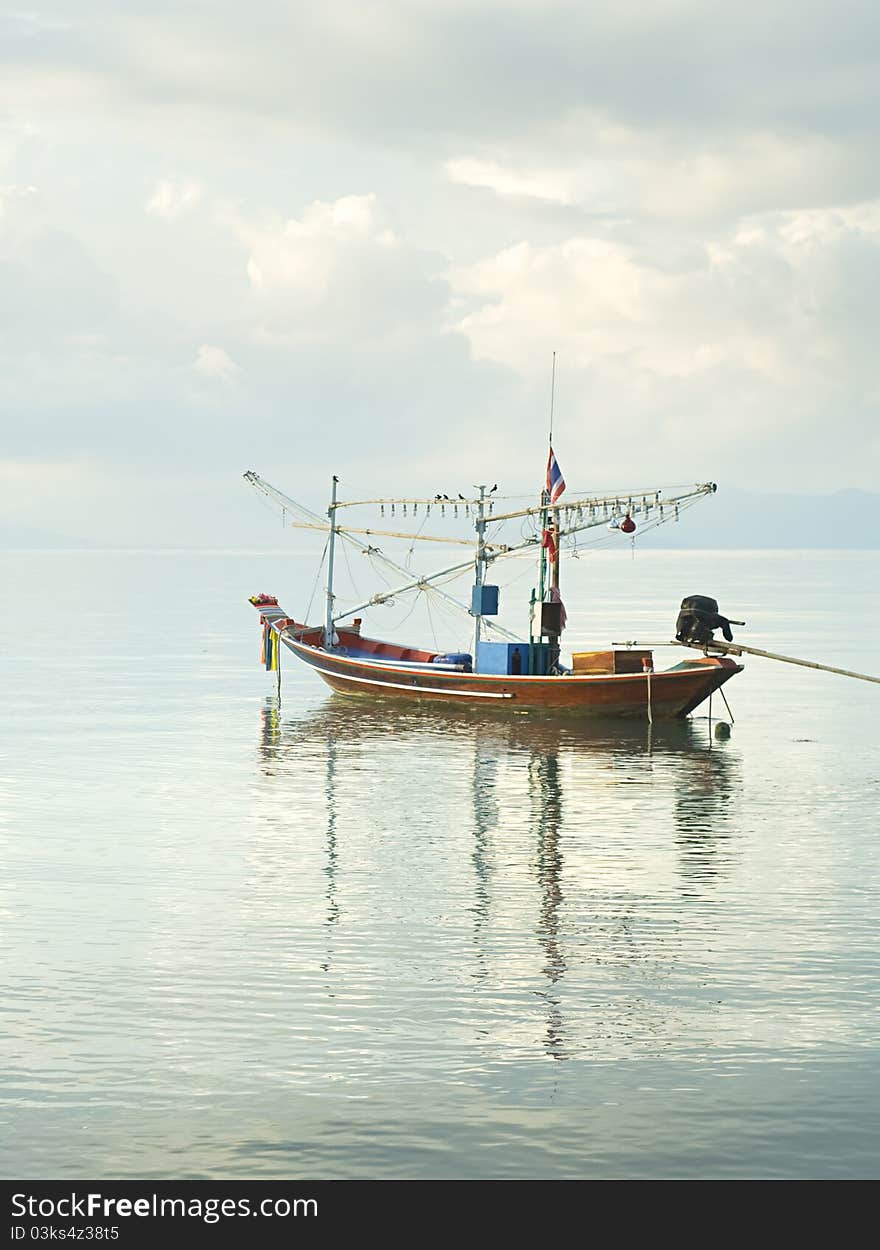 Traditional thailand boat  in the sea at sunrise