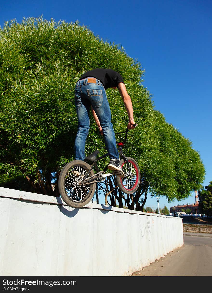 Boy Jumping From Wall On Bmx