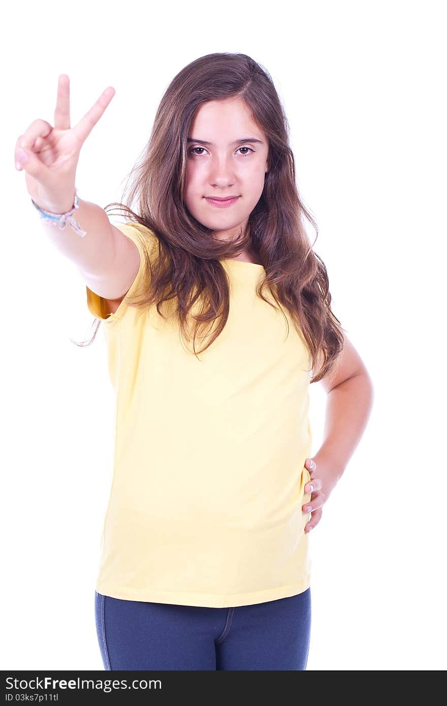 Beautiful smiling teenage girl making victory sign with her hand and smiling