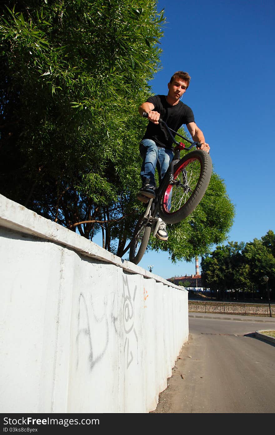 Boy Jumping From Wall On Bmx