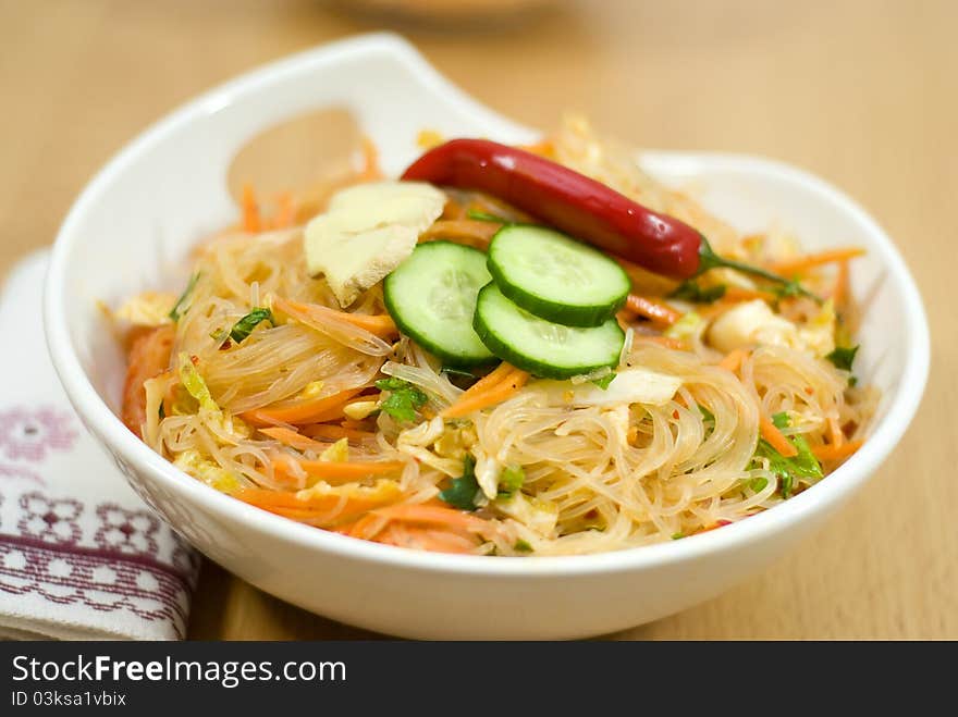 Salad of Korean noodle in the white bowl