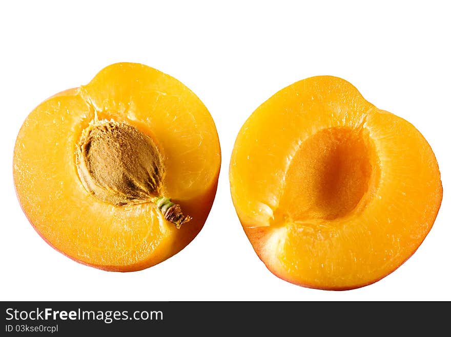 Apricot cut in half isolated on white. Apricot cut in half isolated on white