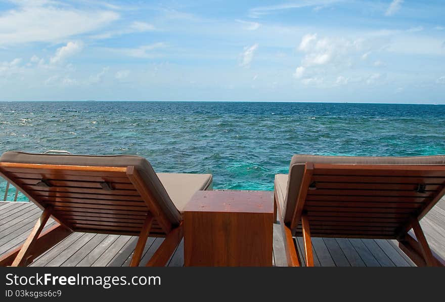 Sitting in chair watching the sea. Sitting in chair watching the sea