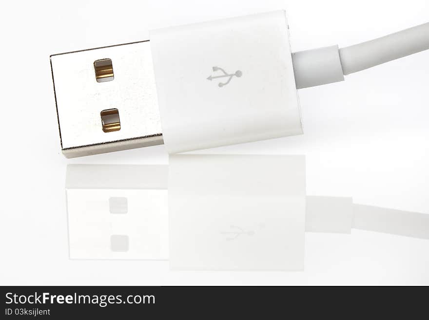 A white USB cable against a white background