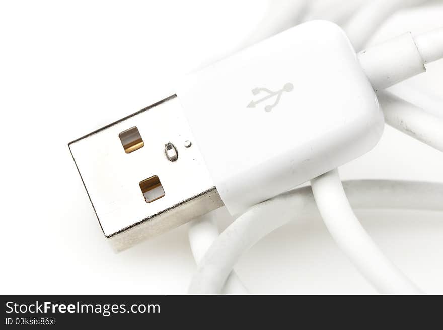 A white USB cable against a white background