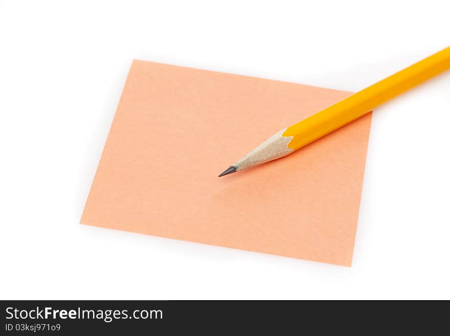 A colorful note pad with a pencil against a white background