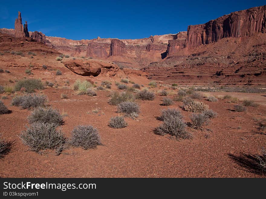 This view was captured in area along the White Rim Road near Airport camping area in the Canyonlands National Park. These massive land formations are much larger than they appear in any image. This view was captured in area along the White Rim Road near Airport camping area in the Canyonlands National Park. These massive land formations are much larger than they appear in any image.