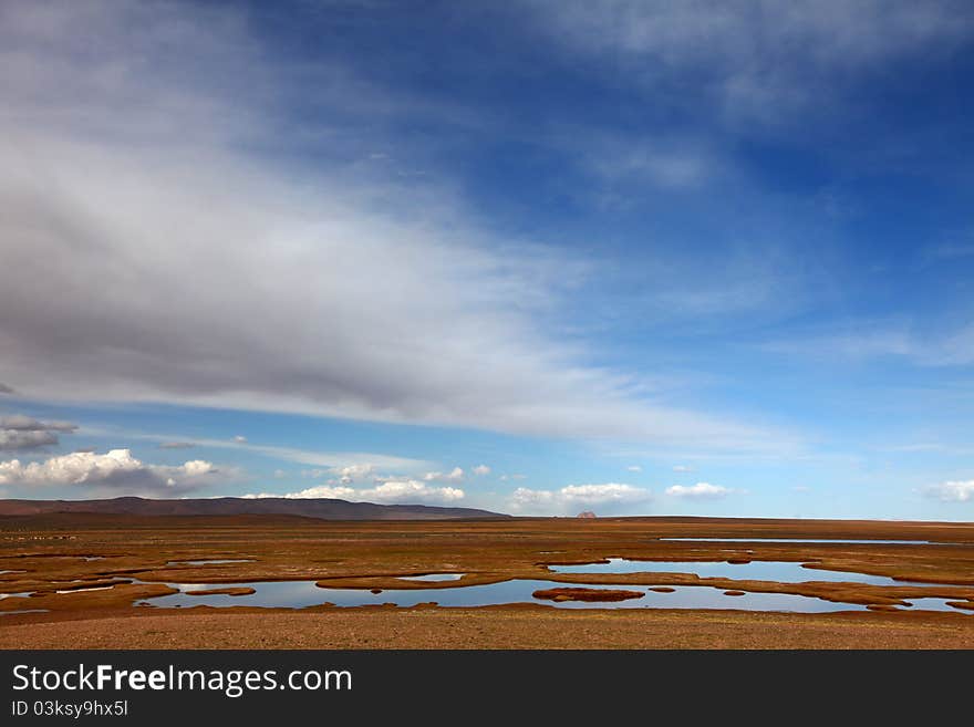 Couldscape over beautiful wetland in Tibet. Couldscape over beautiful wetland in Tibet