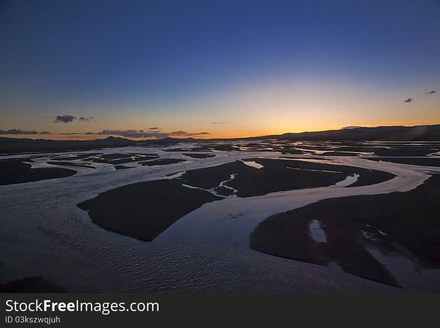 Sunset over Tuotuo River, the headstream of Yangtze River. Sunset over Tuotuo River, the headstream of Yangtze River