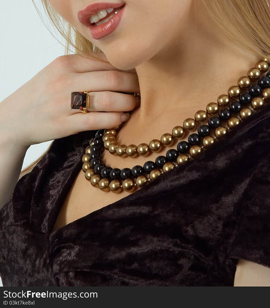 Beautiful woman wearing pearl beads and ring. Beautiful woman wearing pearl beads and ring