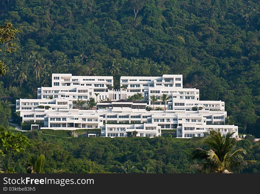 White building on mountain of coconut tree