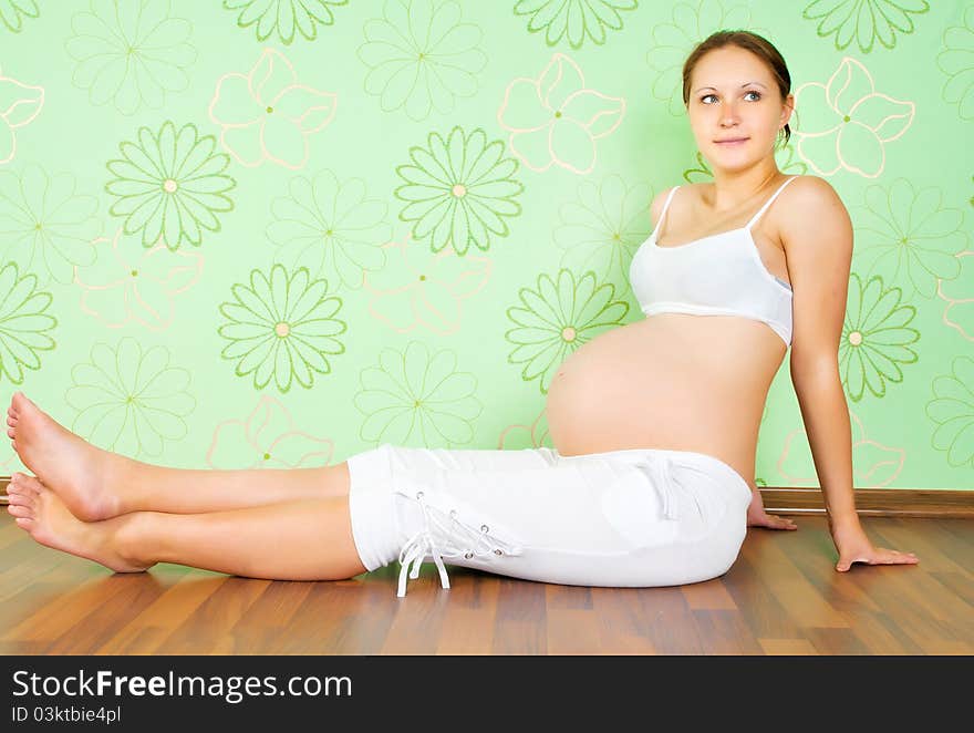 Lovely pregnant woman waiting for a child