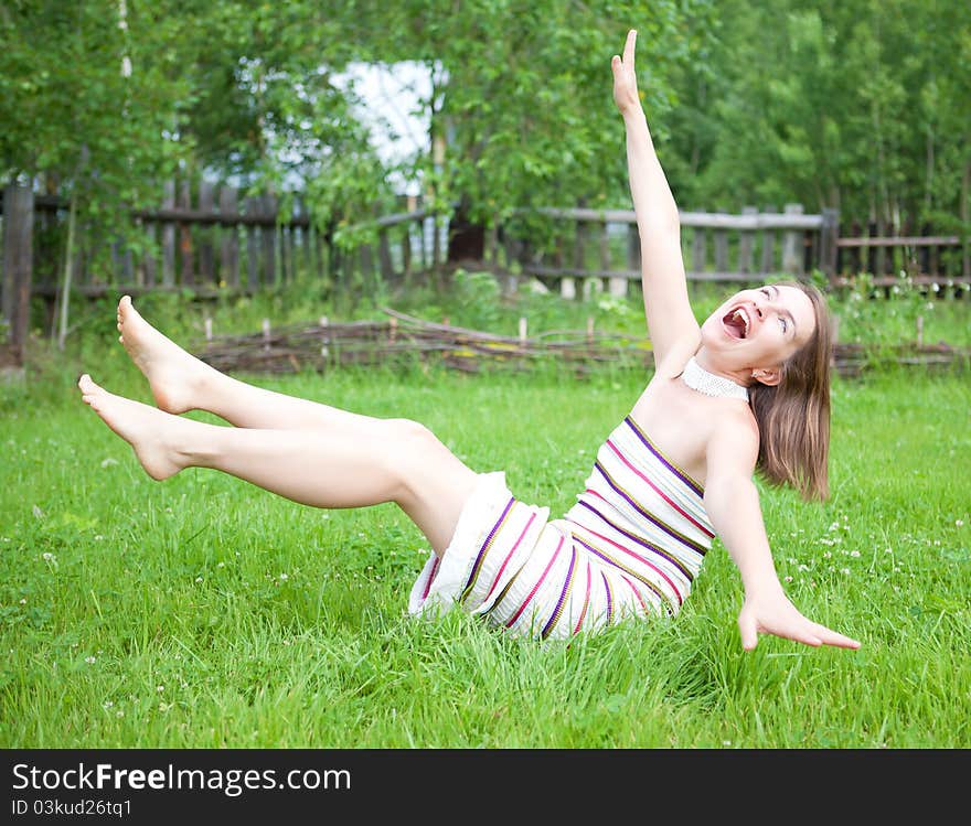 Young Women Falling On Grass