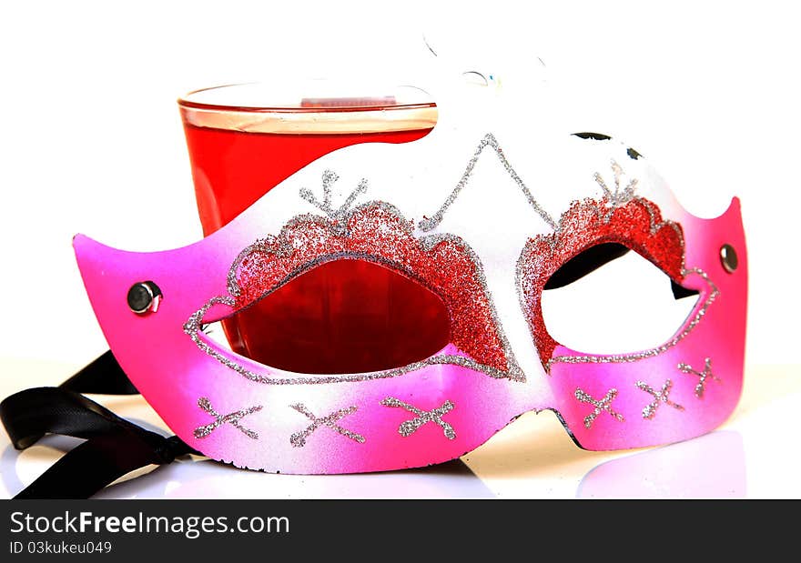 Party mask with drink over white background. Party mask with drink over white background.