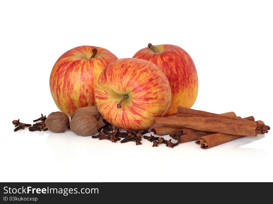 Apple gala fruit variety with clove, cinnamon and nutmeg spice isolated over white background. Apple gala fruit variety with clove, cinnamon and nutmeg spice isolated over white background.