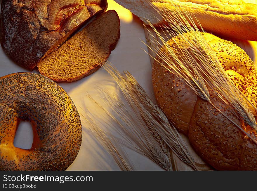 Bread on a table under light of the morning sun. Bread on a table under light of the morning sun