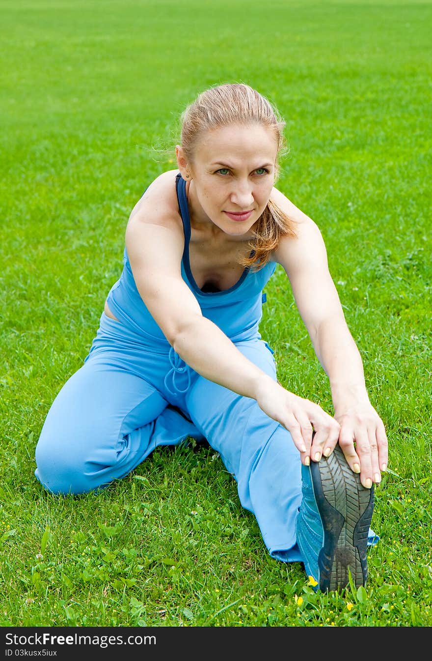 Attractive a Woman stretching before Fitness and Exercise