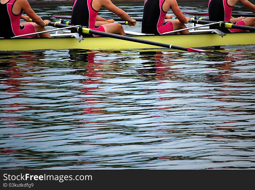 Rowers in action in a race on the river.