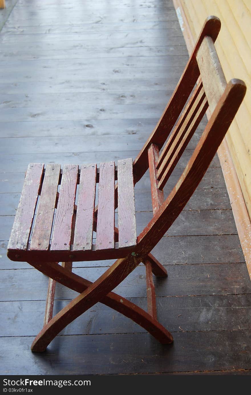 Brown wooden garden chair on veranda