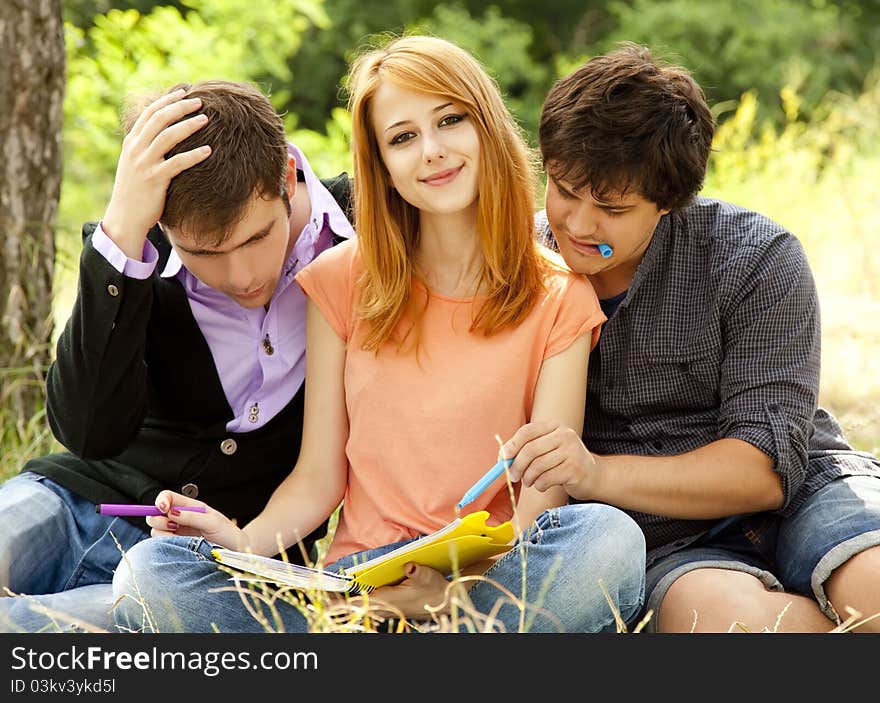 Students at outdoor doing homework.