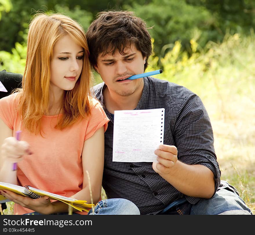 Students at outdoor doing homework.