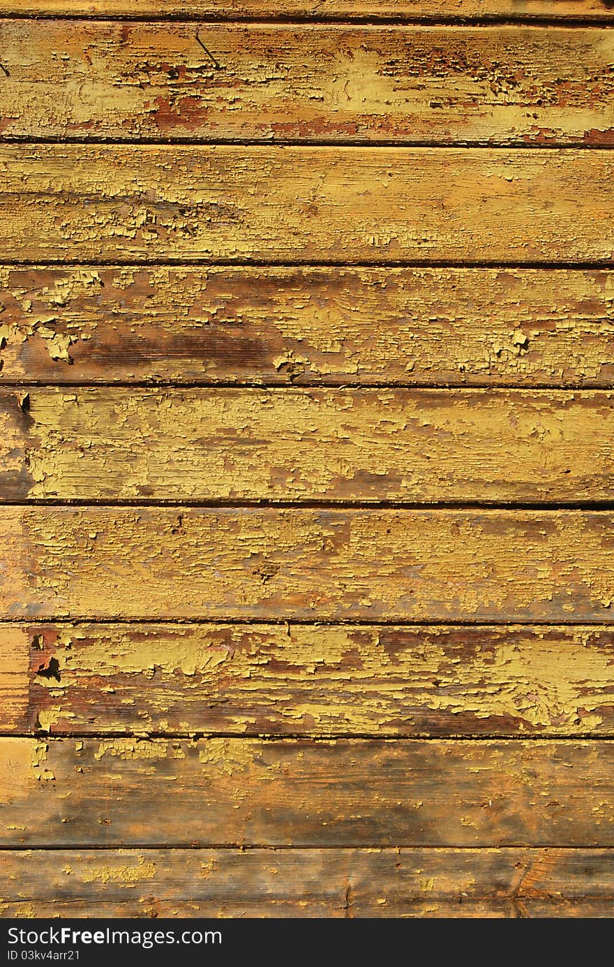 Old shabby painted yellow wooden planks texture. Old shabby painted yellow wooden planks texture