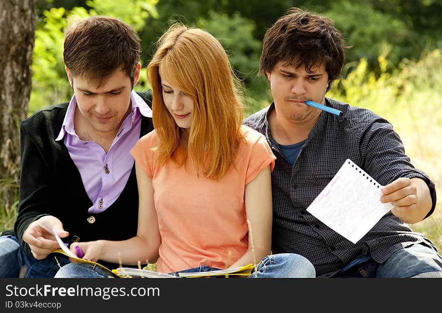 Students at outdoor doing homework.