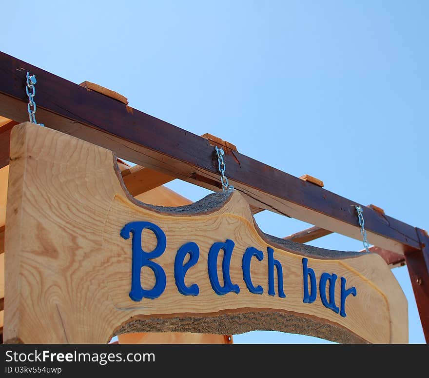 Wooden sign on the beach