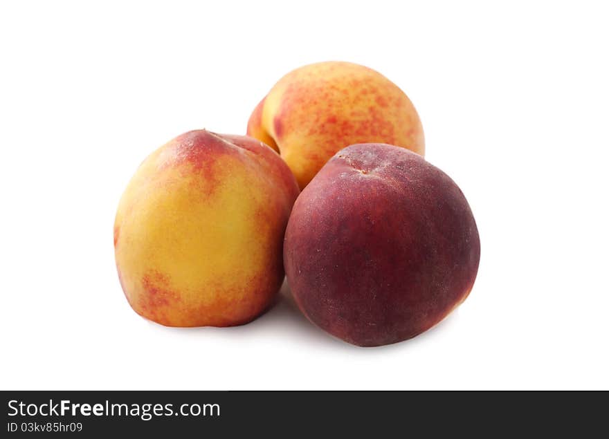 Peaches isolated over white background