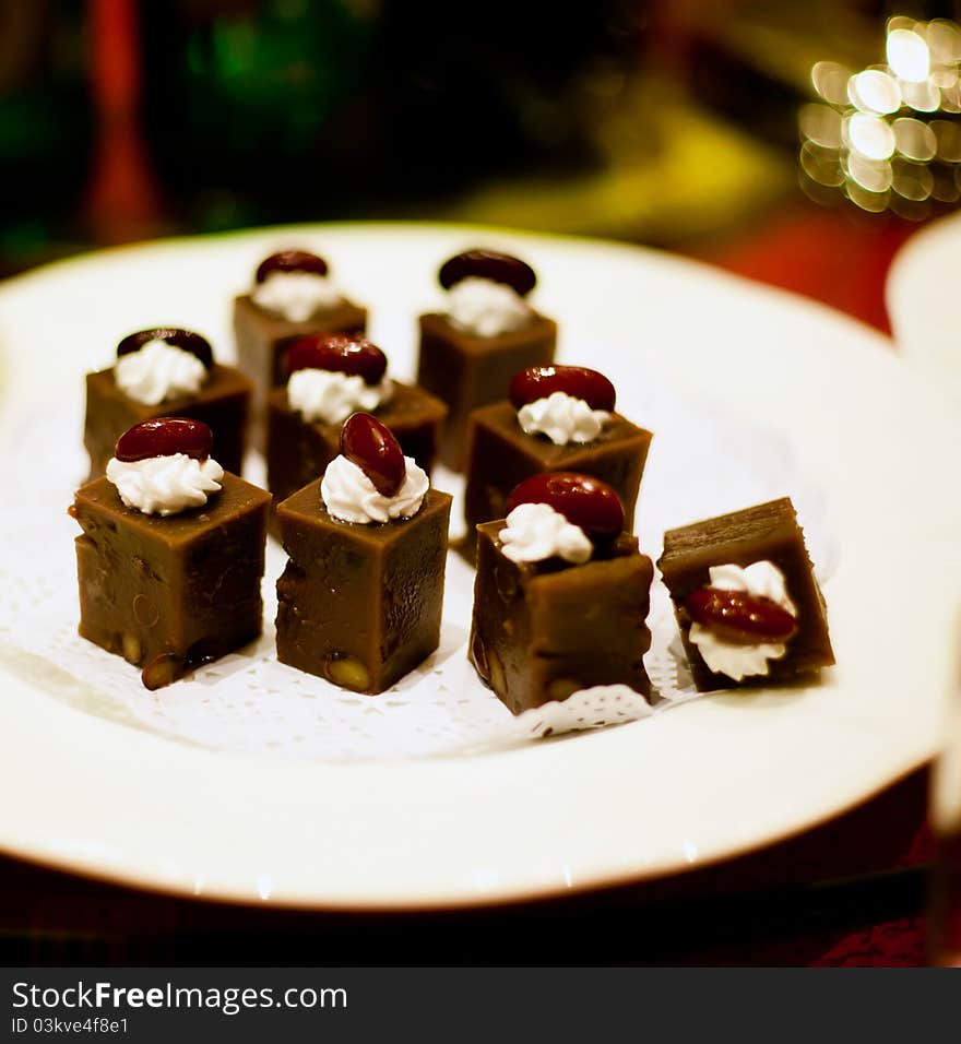 Square cake with bean in plate