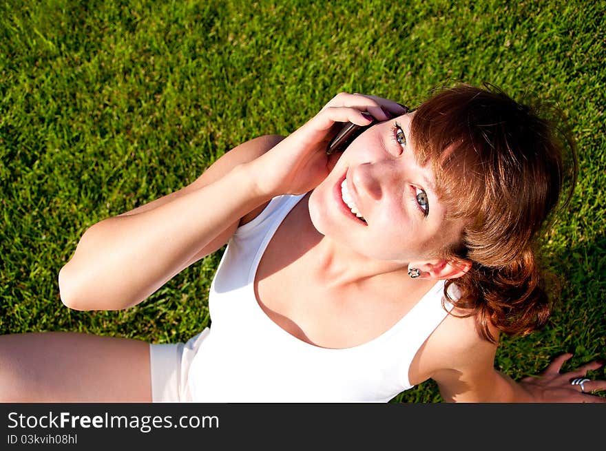 Portrait of young woman talking on cell