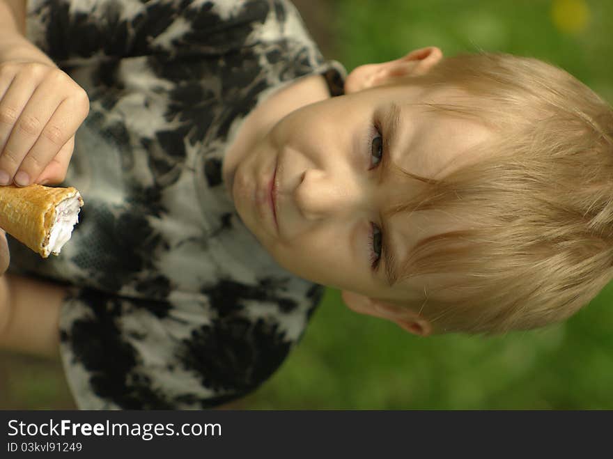 Boy eating an ice-cream. Boy eating an ice-cream