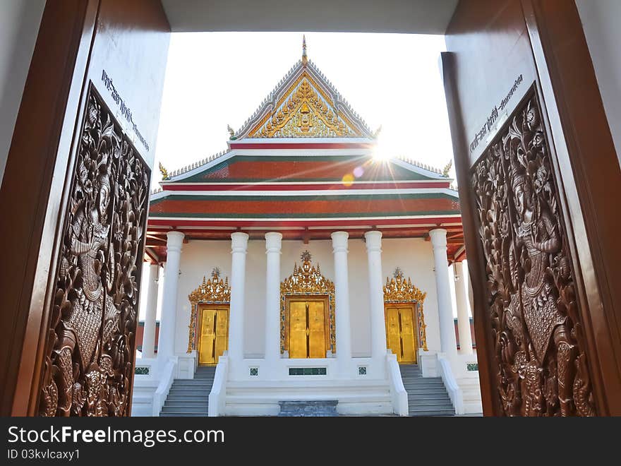 Carved wooden door open to Magut temple, Bangkok Thailand. Carved wooden door open to Magut temple, Bangkok Thailand